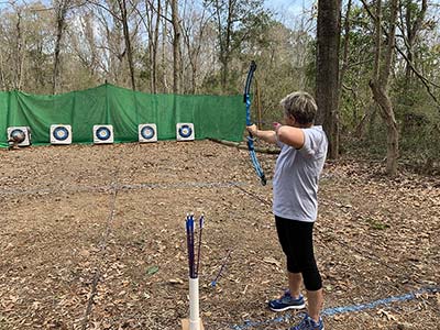 Gail Pilgram doing Archery at JICP